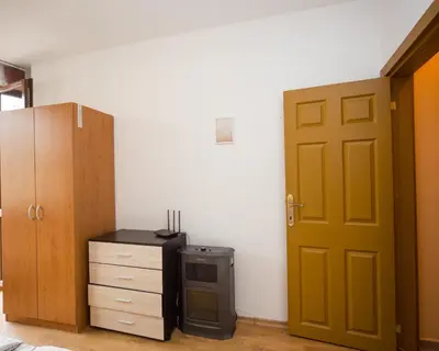 a room with a door and a desk and a stove at ALEKS Top Center in Burgas City