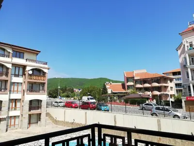 a city with cars parked in a parking lot at Lovely Studio in a Complex with a Pool by Flat Mаnаger in Sveti Vlas