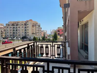 a balcony with a view of a city with buildings at Lovely Studio in a Complex with a Pool by Flat Mаnаger in Sveti Vlas