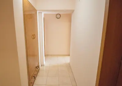 a hallway with a door and a tile floor at Rooms in New Town Nessebar by Flat Mаnаger in Nesebar