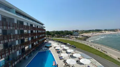a view of a hotel with a swimming pool and a beach at PARADISO 'В' 102 PRIVATE SEA VIEW Apartment in Nesebar