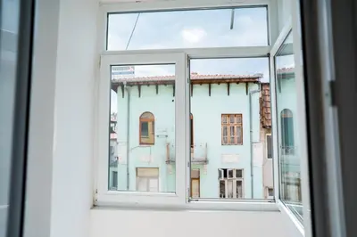an open window with a view of a building at Black Sea Top Centre Apartments by Flat manаger in Varna City