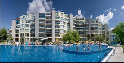 a large swimming pool in front of a large building at Dadi Oazis Ravda in Ravda