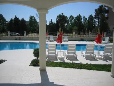 a group of chairs and a swimming pool at Chateau Del Mar Holiday Apartments in Sunny Beach