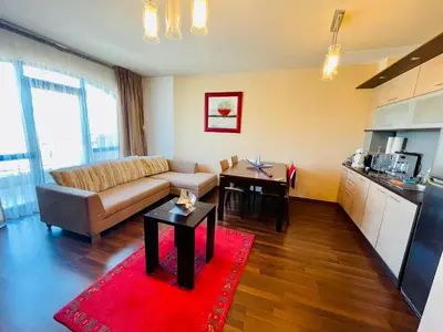 a living room with a couch and a red rug at Luxury apartment whit sea view at Sunny Beach in Sunny Beach