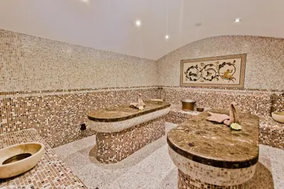 a bathroom with two sinks and two toilets at Galeon Residence & SPA in Sunny Beach