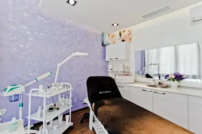 a dental office with a chair in a room at Galeon Residence & SPA in Sunny Beach