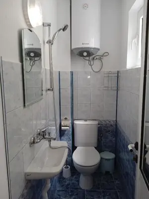 a small bathroom with a toilet and a sink at Guest House DARIS-APHRODEYA Къща за Гости ДАРИС-АФРОДЕЯ in Sozopol