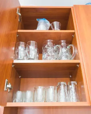a cabinet filled with lots of glass mason jars at SUPER CENTER - Small Flat on 