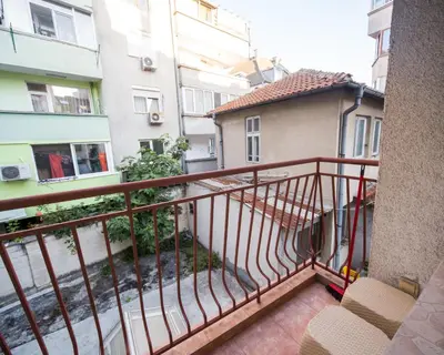 a balcony of a building with a stair case at SUPER CENTER - Small Flat on 