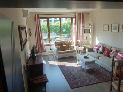 a living room with a couch and a table at Lilly apartment Pomorie in Pomorie