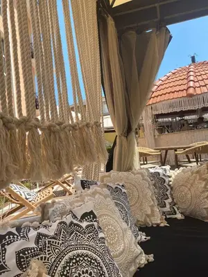 a display of white and black and white pillows at Hacienda Beach complex- Nicoleta apartment in Sozopol