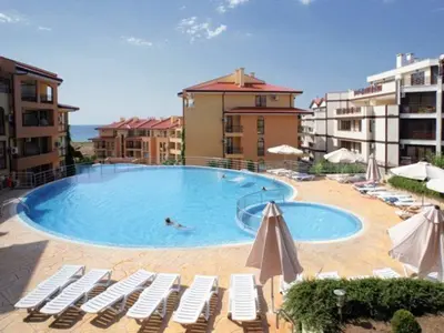 a person swimming in a swimming pool in a hotel at Paradise Dreams - Bulharske More - Sveti Vlas in Sveti Vlas