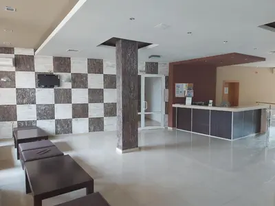 a living room with a checkerboard patterned wall at Paradise Dreams - Bulharske More - Sveti Vlas in Sveti Vlas