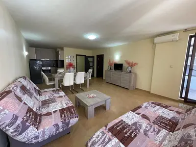 a living room with a couch and a table at Bryan