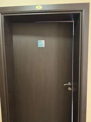 a brown door with a sign on top of it at Bryan