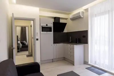a room with a kitchen and a living room at ADIRAMAR Apartments in Obzor