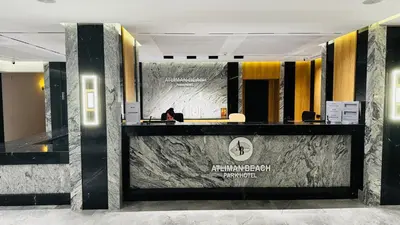 a lobby with a reception desk in a building at Atliman Beach Resort in Kiten