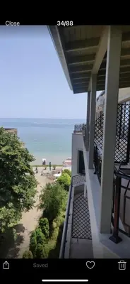 a balcony of a building with a view of the beach at Apartment on the beach 2 in Ravda