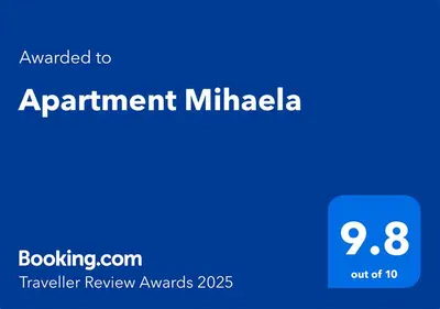 a blue sign that says appointment milhaia with the words travel review awards at Apartment Mihaela in Burgas City