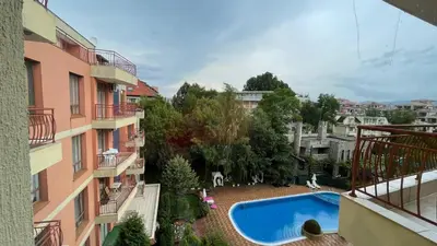 a view of a swimming pool from a balcony of a building at ANITA C 19 Apartment Sunny Beach in Sunny Beach
