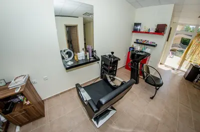a room with a hair salon with a mirror at Orchid Fort Garden in Sunny Beach