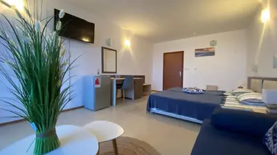 a room with a bed and a couch and a table at ESPERANTO 401 Large Studio Sunny Beach in Sunny Beach
