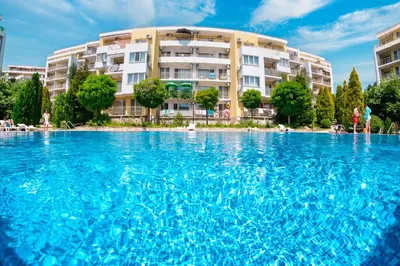 a large swimming pool in front of a building at Imperial Fort Club in Sveti Vlas