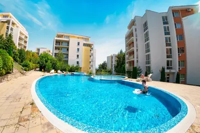 a large swimming pool in the middle of a building at Imperial Fort Club in Sveti Vlas