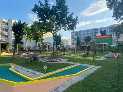 a park with a playground with tables and slides at ESPERANTO 403 Large Studio Sunny Beach in Sunny Beach