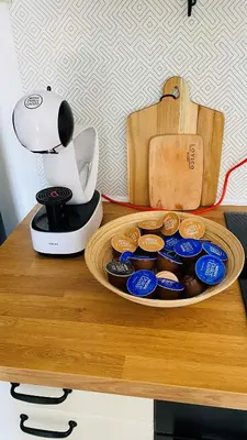 a table with a blender and a plate of cupcakes at Lily Beach - Apartment 408A in Sozopol