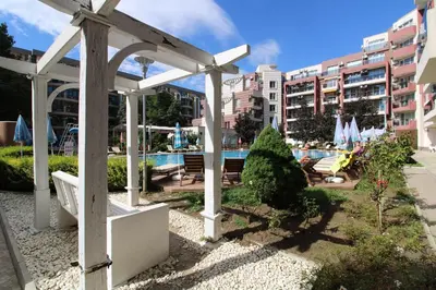 a white pergola next to a swimming pool at Menada Admiral Plaza Apartaments in Sunny Beach