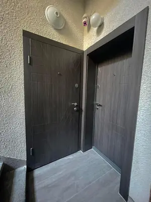 a pair of doors in a room with a wall at Home in Varna City