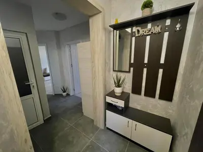 a hallway with a room with a mirror and a table at Dream in Varna City