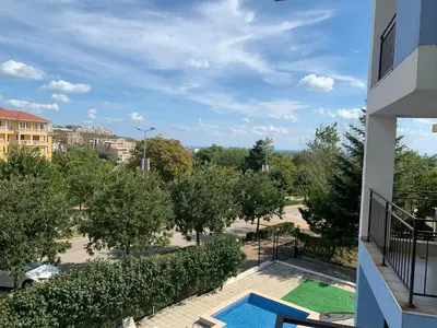 a view of a park from the balcony of a building at Studio Fatinia in Byala