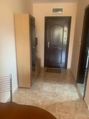 a hallway with a large door in a room at Studio Fatinia in Byala