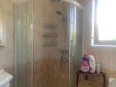 a shower with a glass door in a bathroom at Studio Fatinia in Byala