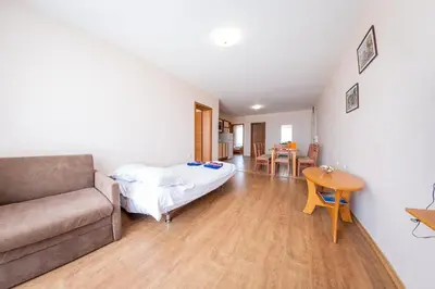 a living room with a couch and a table at Prestige Mer d'Azur in Sunny Beach