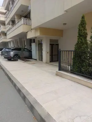 a parking lot in front of a building at Studio Sarafovo in Burgas City