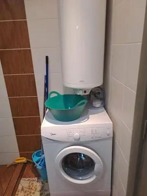 a washing machine with a bowl on top of it at SUNNY BEACH PLAZA Apartments in Sunny Beach