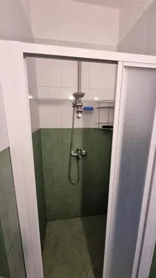 a bathroom with a shower with a glass door at Oasis deluxe apartment by the sea in Ravda