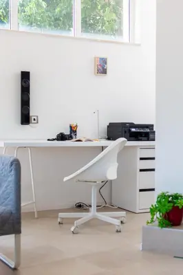 an office with a white desk and a chair at Happy-U house - Modern and with stunning view in Chernomorets