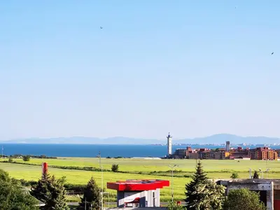 a view of a city with the ocean in the background at Famagusta Antoniya in Aheloy