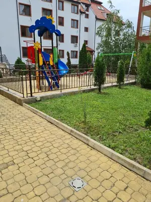 a playground with a slide in a park at Famagusta Antoniya in Aheloy