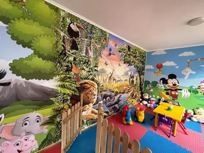 a childs room with a mural of mickey mouse at Famagusta Antoniya in Aheloy