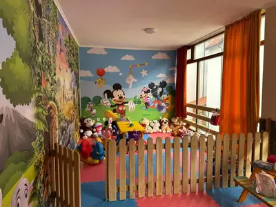 a childs room with a mural of mickey mouse at Famagusta Antoniya in Aheloy
