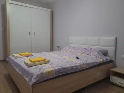 a bedroom with a bed with two towels on it at Summer Burgas Appartment in Burgas City