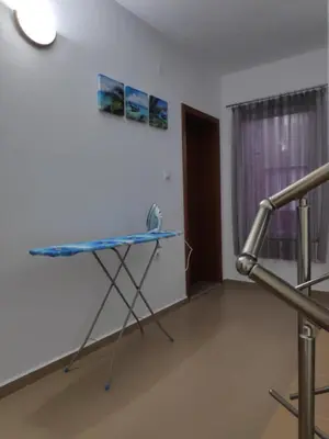 a room with a table in the corner of a room at Къща за гости Снежа/ Guest house Snezha in Obzor