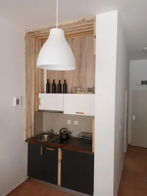 a kitchen with a sink and a pendant light at APARTMENT DELUXE MARINA CAPE 4 stars complex 33 6 in Aheloy