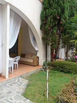 a patio of a house with a couch and a table at APARTMENT STUDIO DELUXE MARINA CAPE 4 stars resort 33 5 in Aheloy